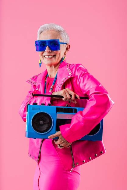 Premium Photo | Happy and funny senior old woman on colorful background