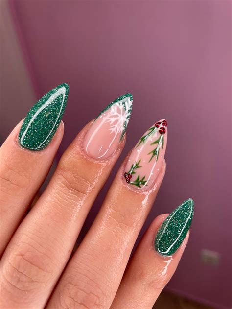 Woman Nails With Christmas Design In Green Colour Acrylic Nails Coffin