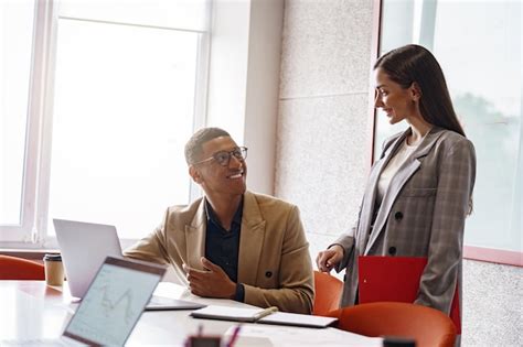 premium photo smiling coworkers cooperating  working