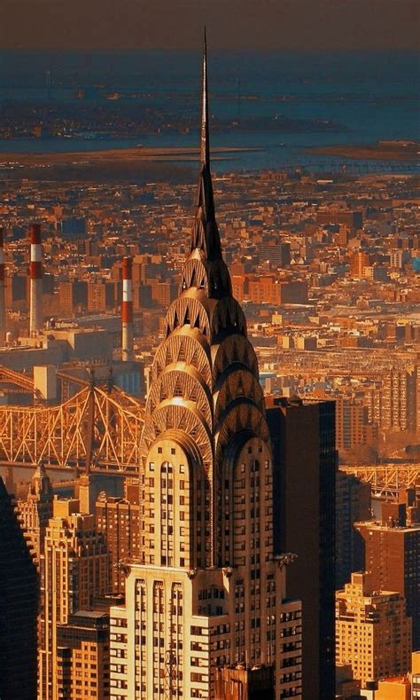 an aerial view of a city with skyscrapers in the foreground and bridges ...