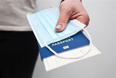 Premium Photo Hands Holding A Passport With Train Ticket And The