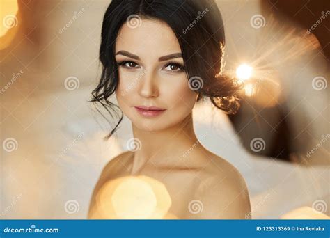 And Beautiful Brunette Model Girl With Stylish Hairstyle And With Perfect Makeup With Naked