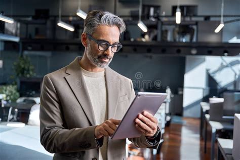 Busy Mature Business Man Employee Sitting At Desk Using Laptop Computer