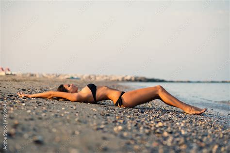 Sexy Woman Wearing Bikini Posing At The Beach Stock Photo Adobe Stock