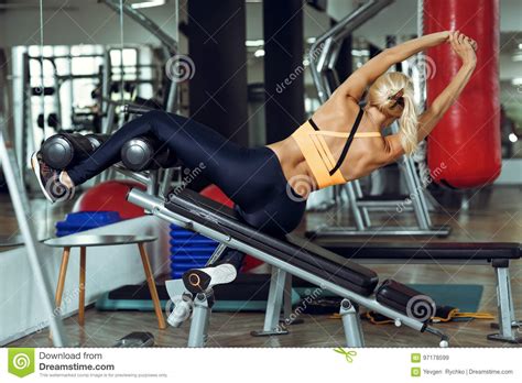 Athletic Blonde Woman Using Press Machine In Gym Stock Image Image Of