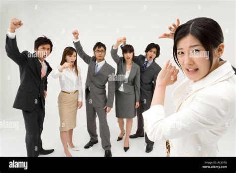 Group of business people shouting at colleague Stock Photo - Alamy