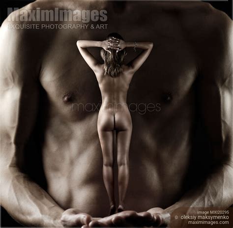 Photo Of Muscular Man Holding Nude Woman In His Hands Stock Image MXI20295