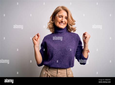 Middle Age Beautiful Blonde Woman Wearing Purple Turtleneck Sweater Over White Background Very