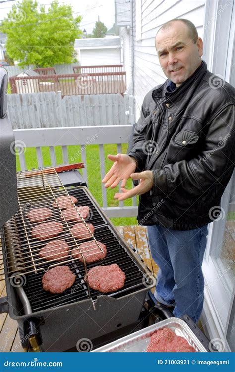 Man Cooking Hamburgers On A Bbq Stock Image Image 21003921