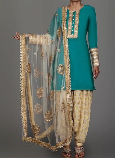 Teal And Golden Cream Brocade Punjabi Suit Features A Taffeta Silk