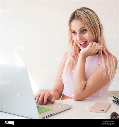 Blonde Influencer Using Laptop Stock Photo Alamy