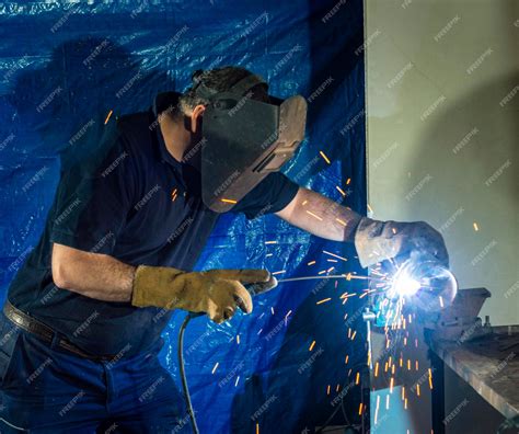 Premium Photo Welding Iron Pipe With Electrode