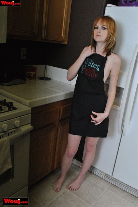 Hot Skinny Amateur Babe Poses In The Kitchen In Her Apron Photos