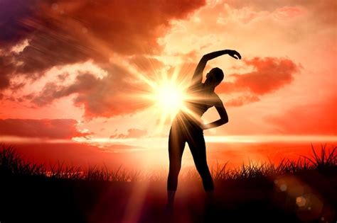 Premium Photo Fit Brunette Stretching Rear View Against Sunrise Over