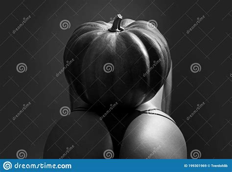 Halloween Party Woman With Big Ass Halloween Witch With A Carved Pumpkin And Magic Lights