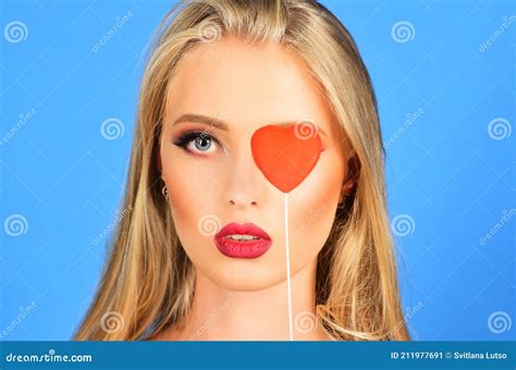 Valentines Day Sensual Woman With Red Heart Fashion Model With Long Blonde Hair Stock Image