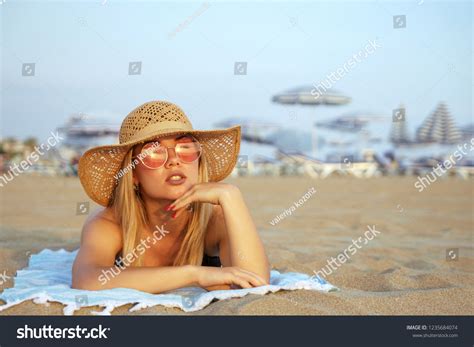 Girl Tanning On Beach Blonde Girl Stock Photo 1235684074 Shutterstock
