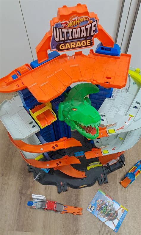 Velká garáž HOT WHEELS CITY s T REXem Aukro