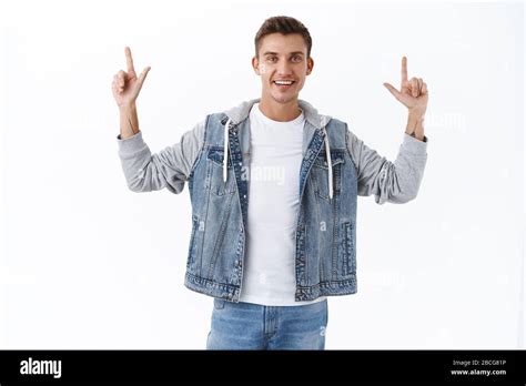 Handsome Outgoing Nice Guy Gay Man With Blond Hair Raise Hands Up Pointing Fingers Up Showing