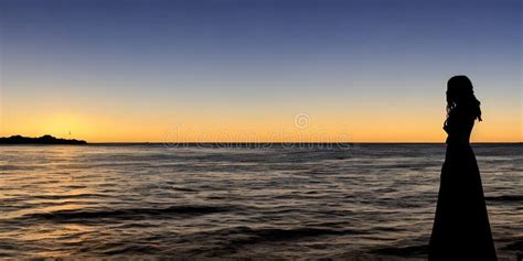 Silhouette Of A Beautiful Woman By The Sea At Sunrise At Dawn Ai