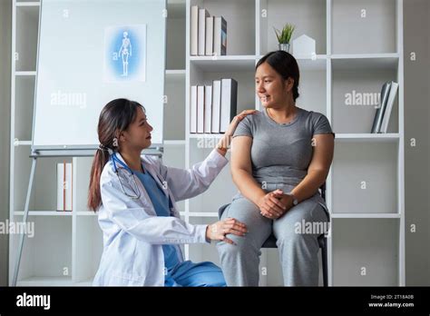 Overweight Woman Having Consultation Doctor At The Clinic Portrait Of