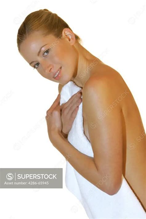 Naked Woman Covers Herself With Towel Superstock