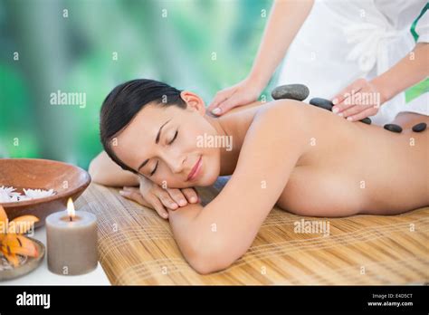 Beautiful Brunette Enjoying A Hot Stone Massage Stock Photo Alamy