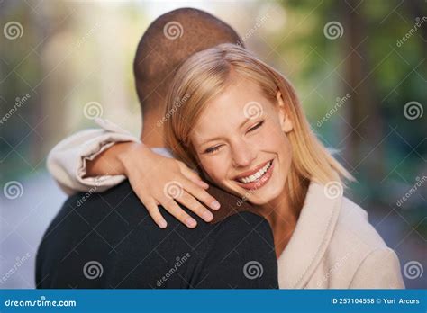 Happiness Is Meeting An Old Friend A Young Couple Embracing Each Other