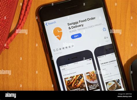 New York, USA - 15 May 2020: Swiggy Food Order mobile app logo on phone screen, close-up icon ...