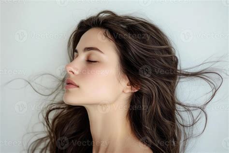 Elegant Brunette Profile With Flowing Hair Stock Photo At Vecteezy