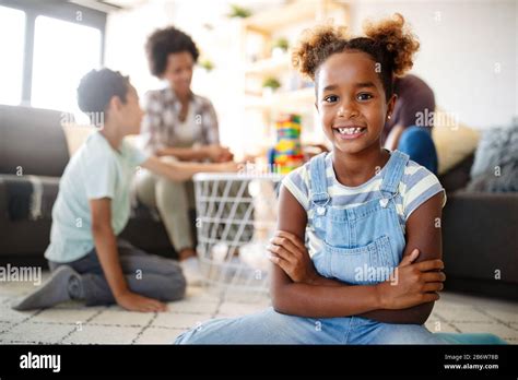 Portrait of black family playing a game at home together Stock Photo ...