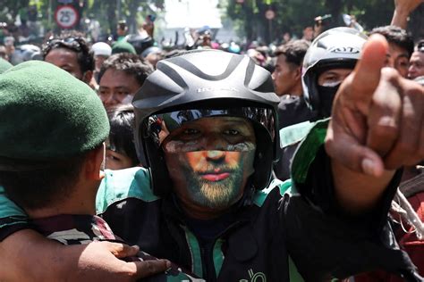 indonesia protests intensify   year  motorcycle taxi driver