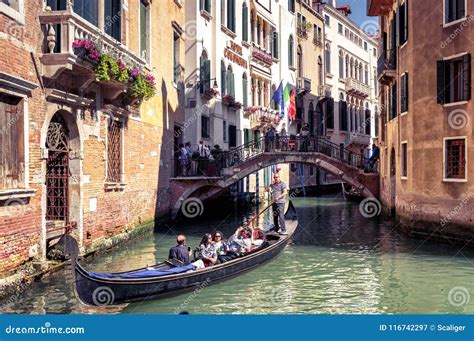 Gondola Floats Along The Old Narrow Street In Venice Editorial