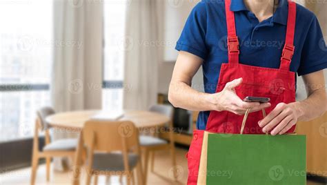 Box With Fast Food Being Carried By Delivery Man In Uniform For One Of