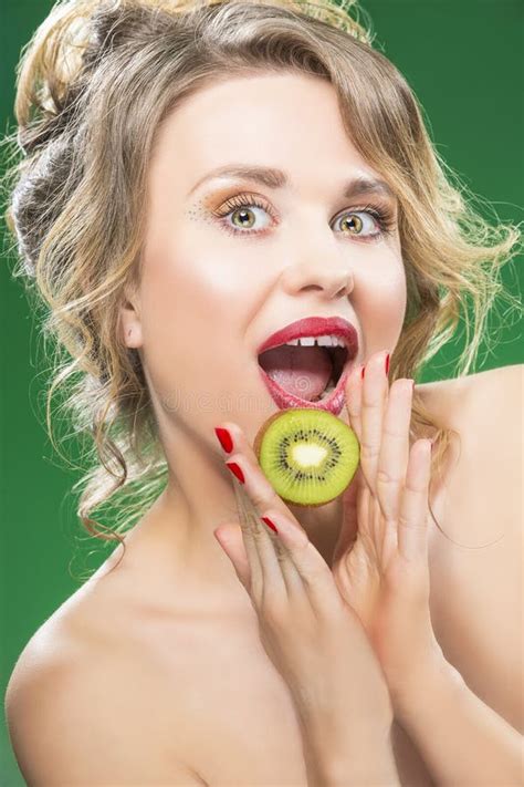 Fruit Kiwi Series Closeup Of Sensual And Naked Caucasian Model With Teeth Diastema Posing With