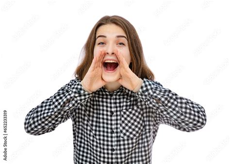 Portrait Of Brunette Eighteen Year Old Girl Shouting Out Loud With