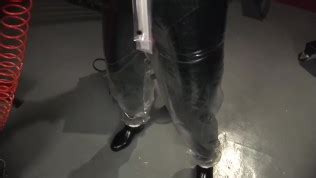 Blonde Girl In Black Latex Catsuit Full Encased In Inflatable Rubber And Full Body Plastic Suit