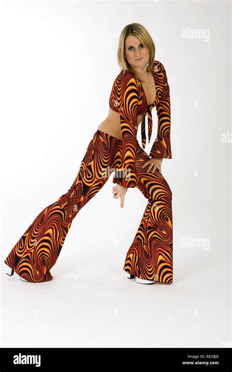 Blonde Girl Wearing Seventies Outfit Against A White Background Portrait Stock Photo Alamy