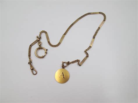 pocket  gold plated chain links  openwork rectangles el