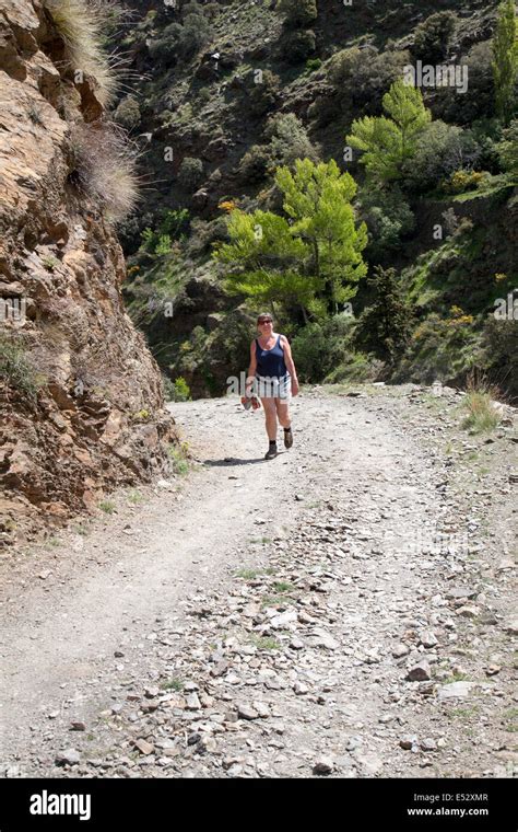 Woman Walking In The The River Rio Poqueira Gorge Valley High