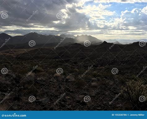 Rainstorm in Mojave Desert stock photo. Image of contrast - 155338786