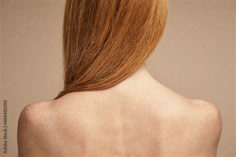 Minimal Back View Of Freckled Red Haired Woman With Nude Shoulders Copy Space Stock Photo