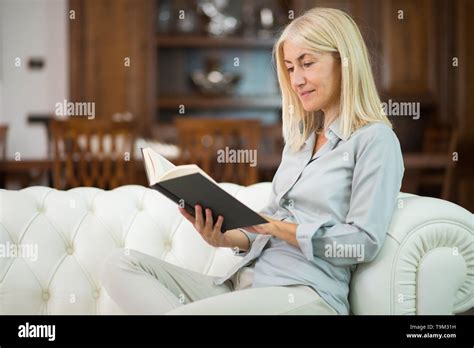 Mature Woman Reading A Book Stock Photo Alamy