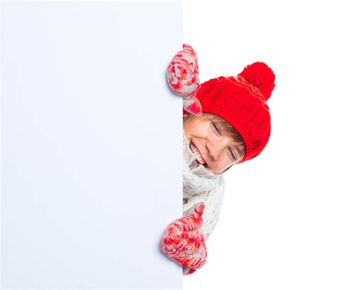 Premium Photo Teenager In Winter Style Looking At A Blank Board