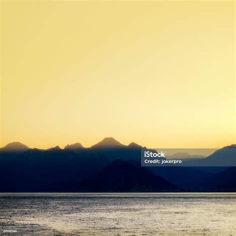 High Mountains Over Clear Sunset Sky Stock Photo - Download Image Now ...