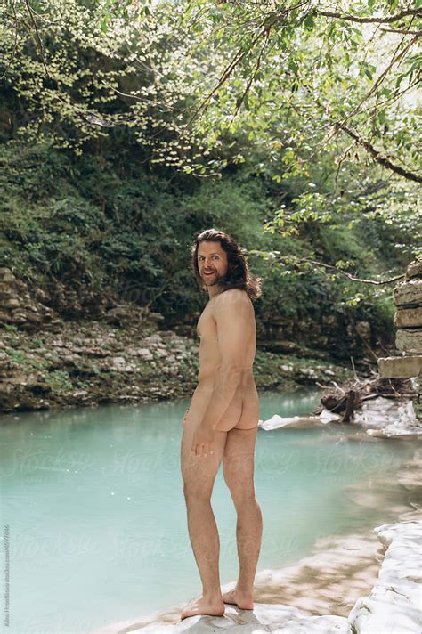 Naked Man Preparing To Swim In River By Stocksy Contributor Alina Hvostikova Stocksy
