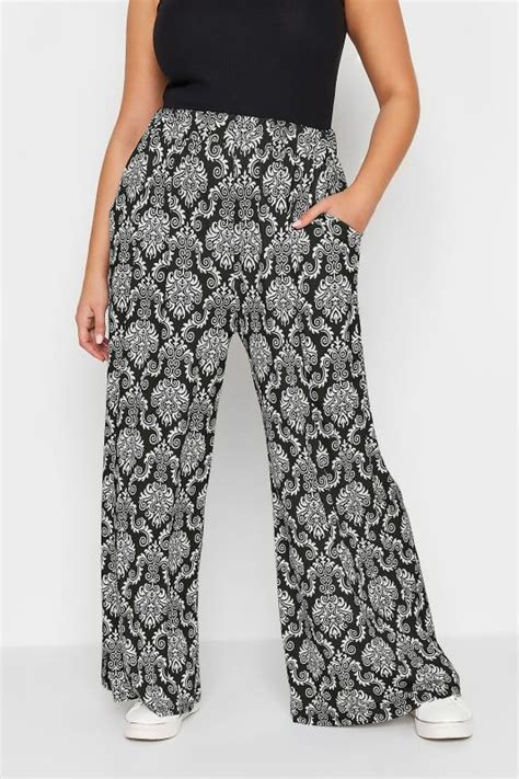 Yours Plus Size Black Paisley Print Pull On Wide Leg Trousers Yours Clothing