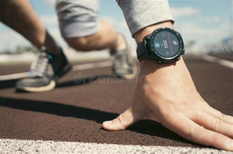 Man Is Preparing To Start On A Treadmill Smart Watch On The Athlete S