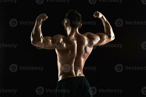 Very Muscular Man Posing With Naked Torso In Studio Stock Photo At Vecteezy