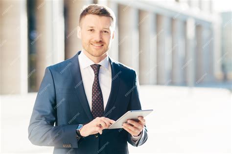 Premium Photo | Cheerful successful young male executive manager wears ...